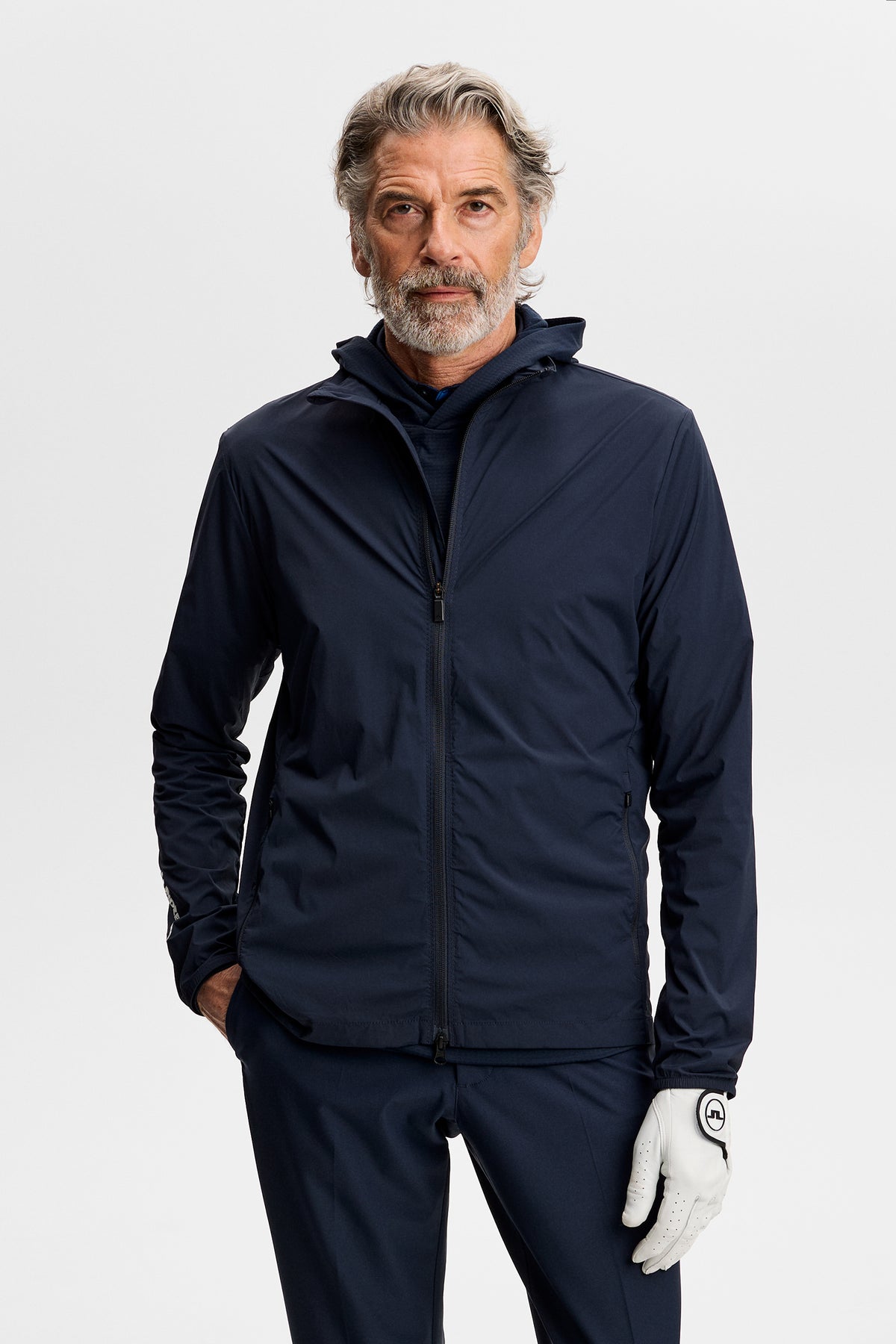 J.Lindeberg Tour Tech Packable Jacket JL Navy – front view on course