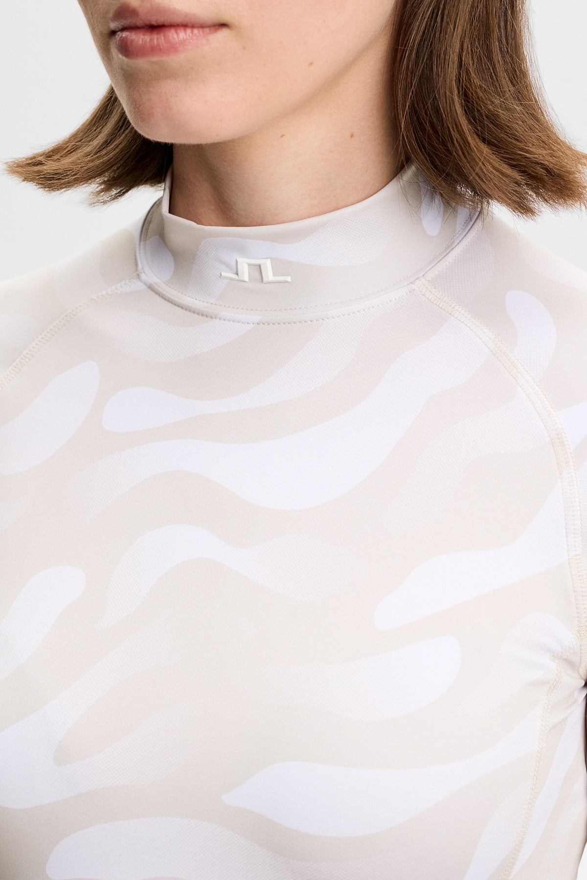 J.Lindeberg Ella Print Compression Top &ndash; UPF 40+ a odvod vlhkosti